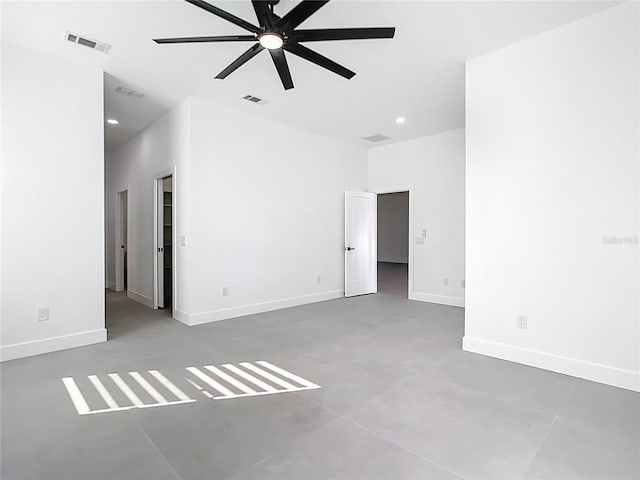 unfurnished room with visible vents, baseboards, and a ceiling fan