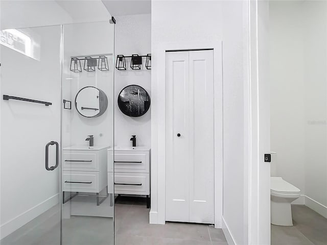 full bathroom with tile patterned floors, baseboards, toilet, and vanity