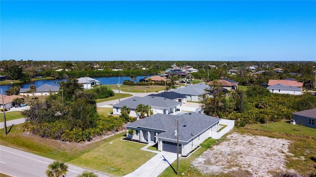 aerial view featuring a residential view and a water view