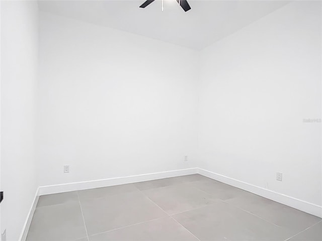 empty room with baseboards and ceiling fan