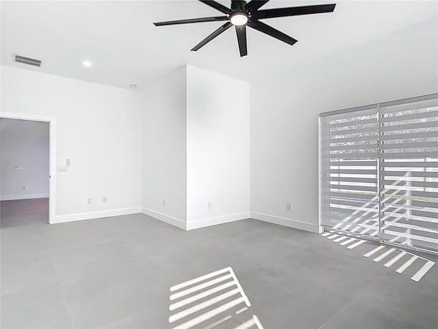 empty room featuring visible vents, concrete floors, baseboards, ceiling fan, and recessed lighting