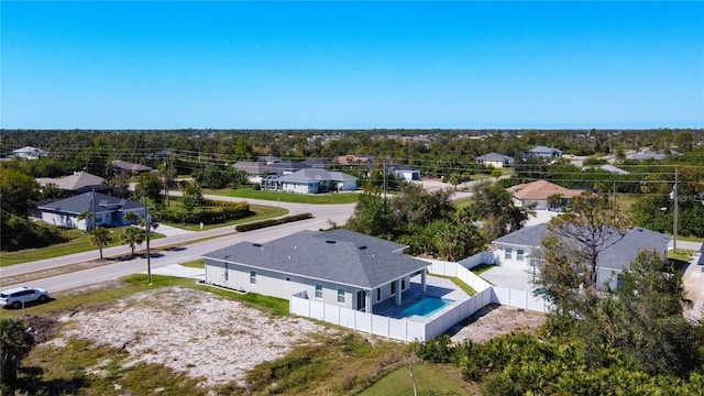 birds eye view of property with a residential view