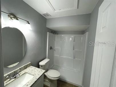 full bathroom with bathtub / shower combination, toilet, and vanity