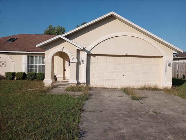 single story home featuring a garage