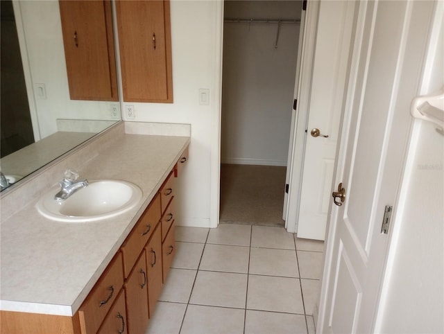 bathroom with tile patterned floors and vanity