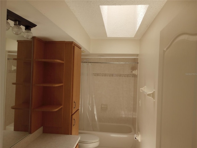 bathroom with shower / bath combination with curtain, toilet, a textured ceiling, and a skylight