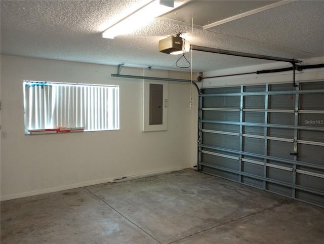 garage with electric panel and a garage door opener