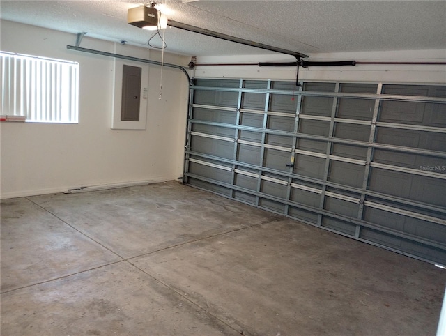 garage featuring electric panel and a garage door opener