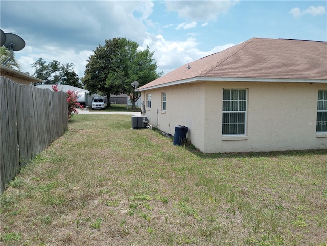 view of yard featuring central AC unit