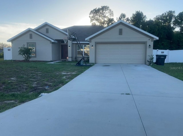 ranch-style house with a garage and a front yard