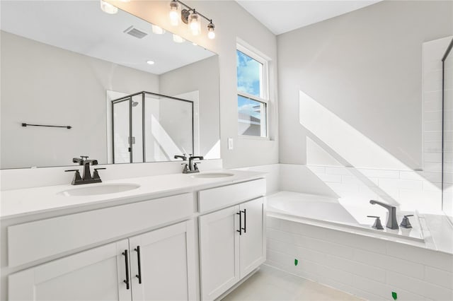 bathroom featuring tile patterned floors, vanity, and separate shower and tub