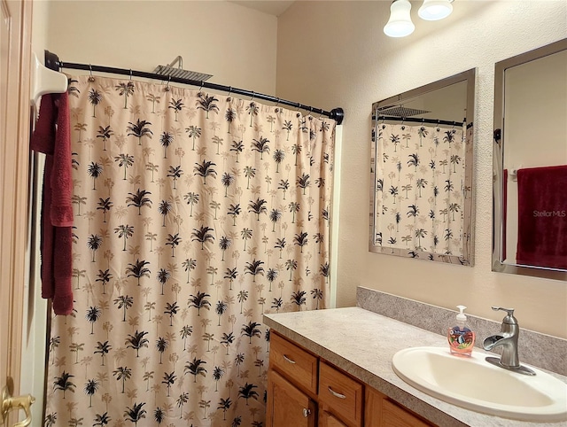 bathroom featuring vanity with extensive cabinet space