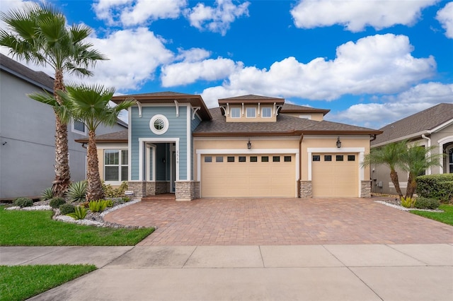 prairie-style house featuring a garage