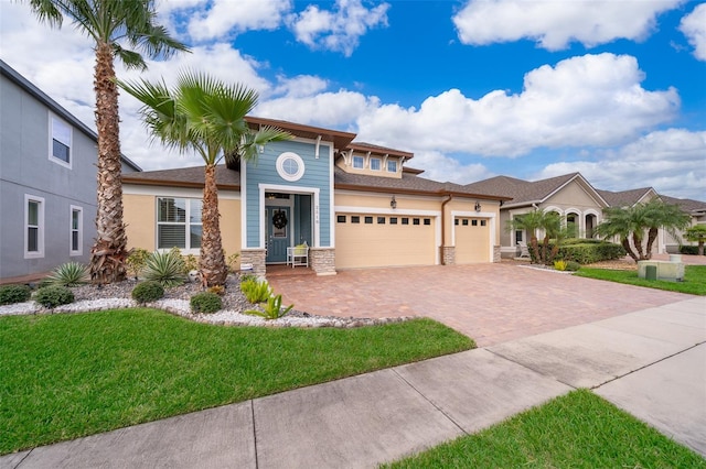 view of front of property with a garage and a front yard