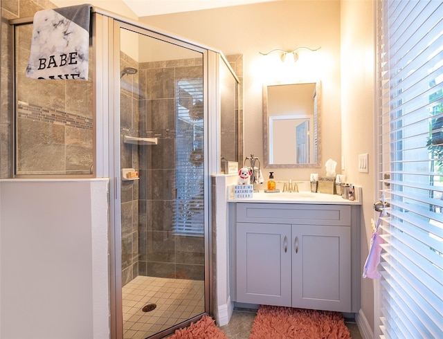 bathroom featuring vanity and an enclosed shower