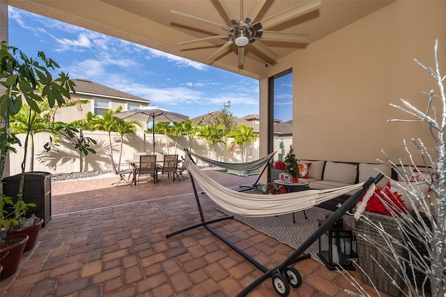 view of patio featuring ceiling fan