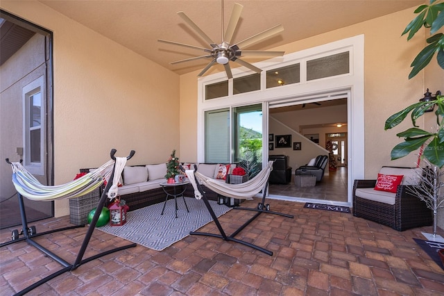 view of patio featuring an outdoor living space and ceiling fan