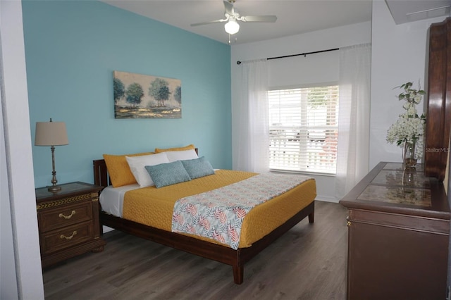 bedroom featuring ceiling fan and dark wood-type flooring