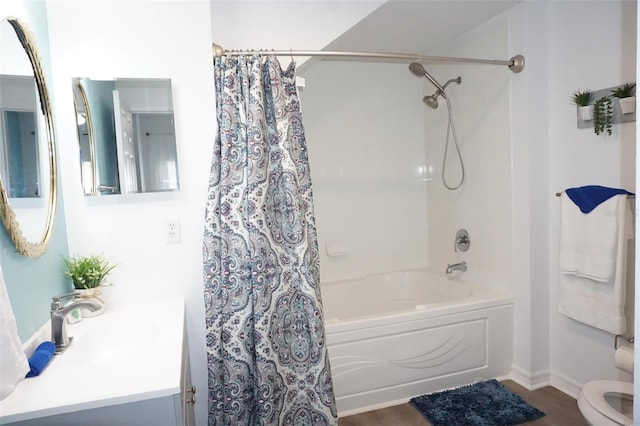 full bathroom featuring hardwood / wood-style flooring, vanity, toilet, and shower / bath combo with shower curtain