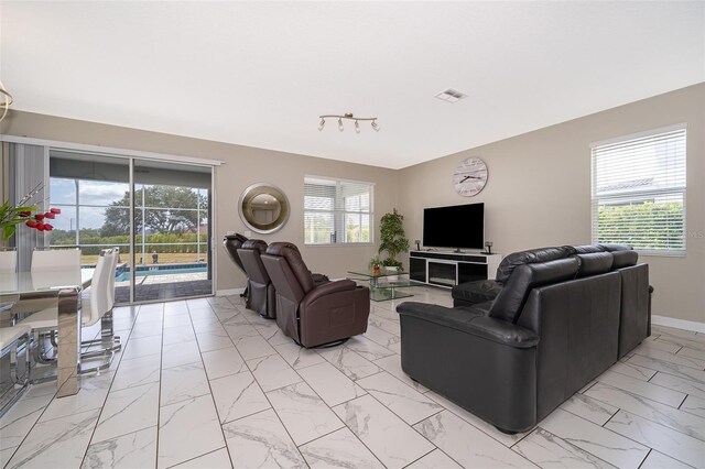 living room with plenty of natural light