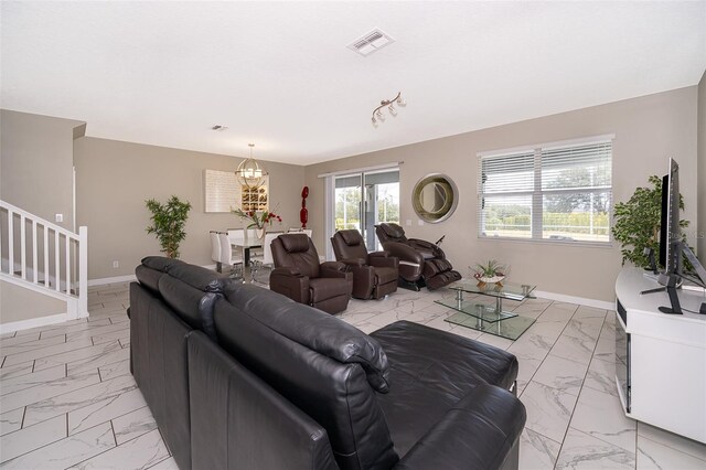 living room with an inviting chandelier