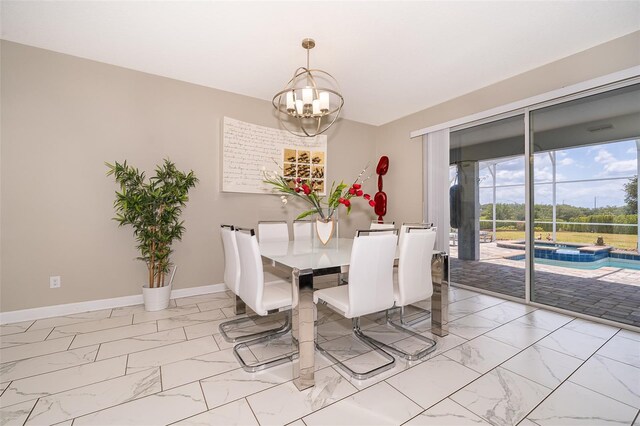 dining area featuring an inviting chandelier