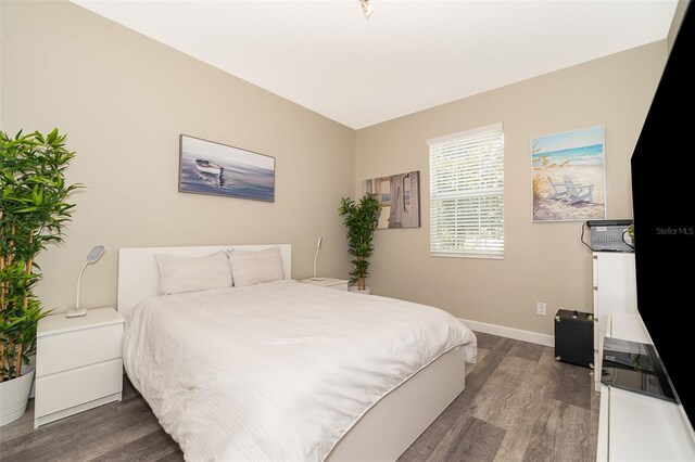 bedroom featuring dark hardwood / wood-style floors