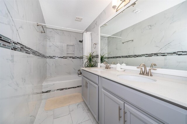 bathroom featuring vanity and shower / tub combo