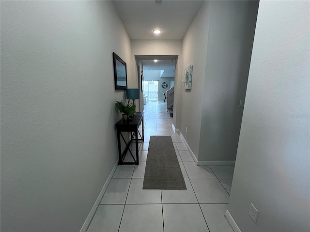 corridor with light tile patterned flooring