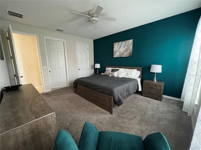 carpeted bedroom with ceiling fan