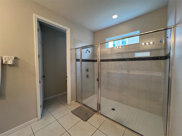 bathroom featuring tile patterned flooring and walk in shower