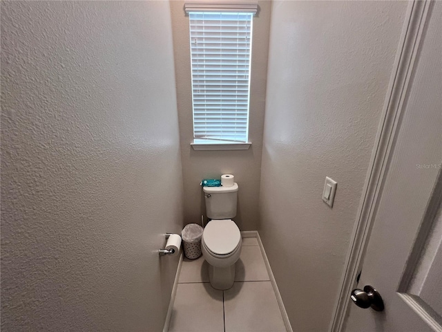 bathroom with a wealth of natural light and toilet