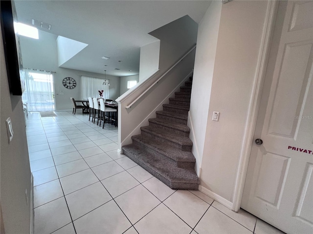 stairway with tile patterned floors