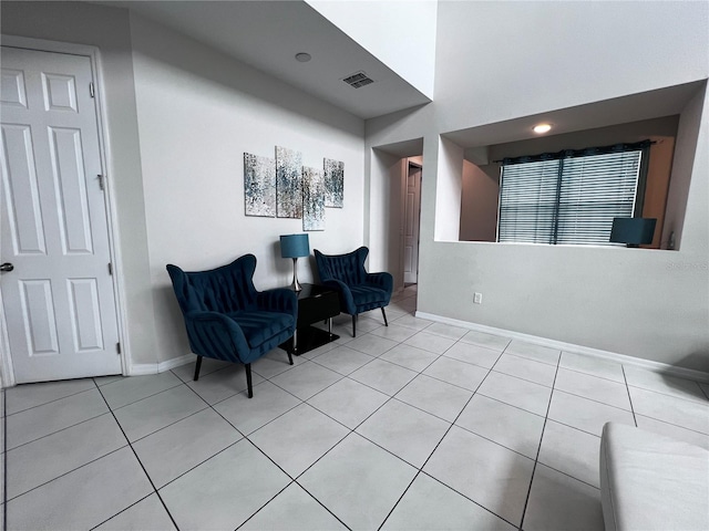 sitting room featuring light tile patterned floors