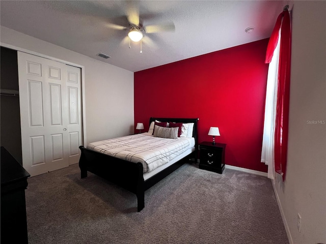 bedroom with carpet, a textured ceiling, a closet, and ceiling fan