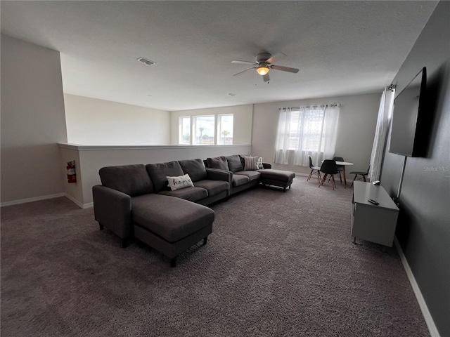 living room with dark colored carpet and ceiling fan