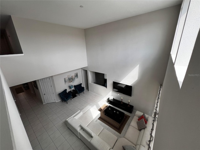 unfurnished living room with light tile patterned floors