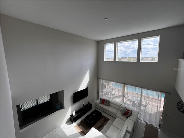 unfurnished living room featuring light tile patterned flooring