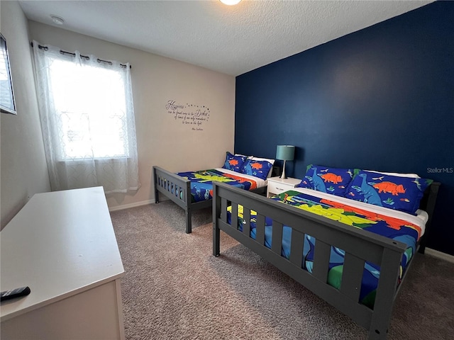 carpeted bedroom with a textured ceiling