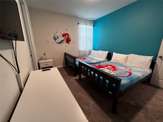 bedroom with dark carpet