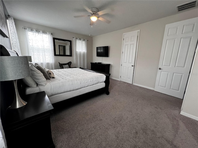 carpeted bedroom with ceiling fan