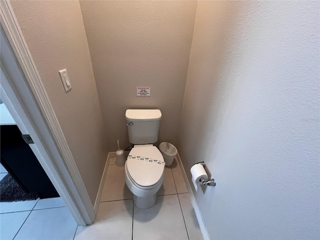 bathroom with tile patterned flooring and toilet