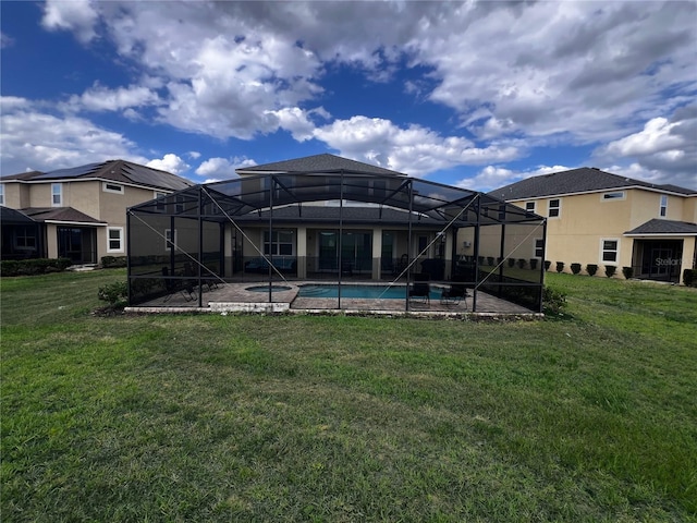 exterior space with glass enclosure and a lawn