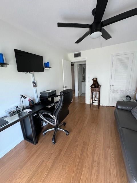 office area featuring ceiling fan and hardwood / wood-style floors