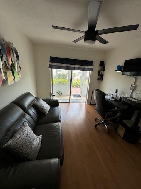 home office featuring hardwood / wood-style floors and ceiling fan