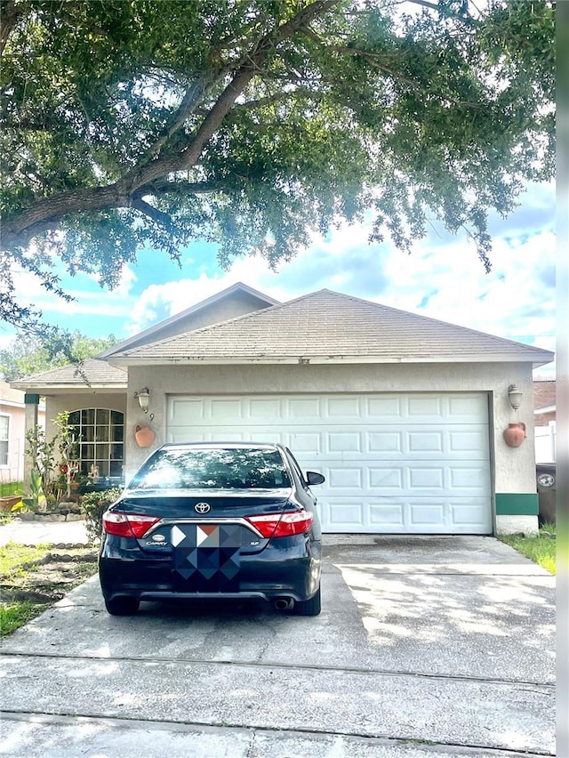 single story home featuring a garage