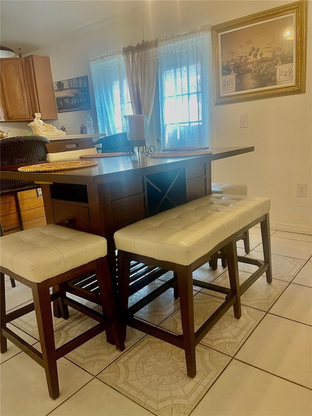 dining room featuring light tile patterned floors