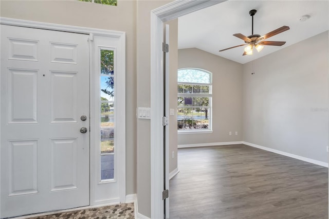 foyer featuring wood-type flooring, vaulted ceiling, and ceiling fan