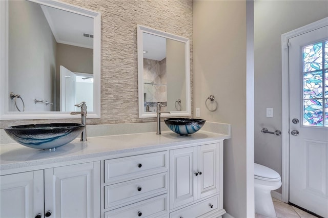 bathroom with tile patterned floors, vanity, and toilet