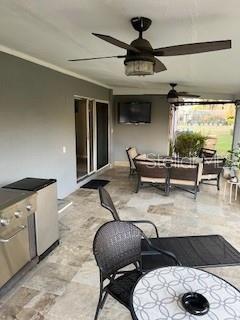 view of patio / terrace with ceiling fan